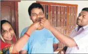  ?? HT PHOTO ?? Shivam Kumar celebrates with his parents after the results.