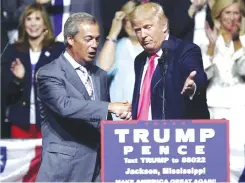  ??  ?? In this file photo, US president-elect Donald Trump (right) welcomes pro-Brexit British politician Nigel Farage, to speak at a campaign rally in Jackson, Miss. — AP
‘No vacancy’