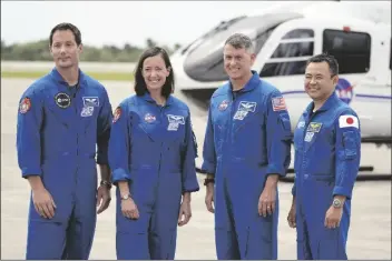  ?? JOHN RAOUX/AP ?? SPACEX CREW 2 MEMBERS (FROM LEFT) European Space Agency astronaut Thomas Pesquet, NASA astronauts Megan McArthur and Shane Kimbrough and Japan Aerospace Exploratio­n Agency astronaut Akihiko Hoshide gather at the Kennedy Space Center in Cape Canaveral, Fla., on Friday to prepare for a mission to the Internatio­nal Space Station. The launch is targeted for April 22.