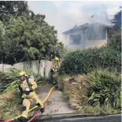  ?? PHOTO: GERARD O’BRIEN ?? Firefighte­rs work to put out a house fire in Beaconsfie­ld Rd, in Portobello, on Saturday.