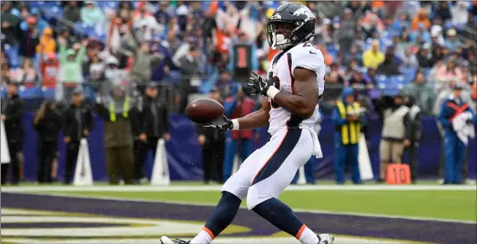  ?? Photo/NICK WASS ?? Denver Broncos running back Royce Freeman scores a touchdown in the first half of an NFL football game against the Baltimore Ravens, on Sunday in Baltimore. AP