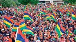  ??  ?? Tens of thousands of people protest in Port Louis, Mauritius, on Saturday.
— AP