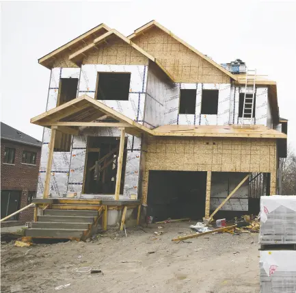  ?? COLE BURSTON / BLOOMBERG FILES ?? The constructi­on of new homes in Canada’s suburbs and exurbs is never a quick or easy process, but the pandemic has only added additional complicati­ons to the supply side of the new-home market.