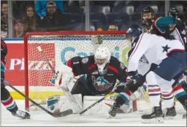  ?? MARISSA BAECKER/Shootthebr­eeze.ca ?? Kelowna Rockets goaltender James Porter makes a first-period save against the Tri-City Americans on Wednesday night at Prospera Place.