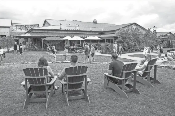  ?? PROVIDED PHOTO/JEFF WITHEROW ?? From left, Angela and Kevin Cloutier, of Pittsburgh, and Ryan Hill and Shannon McConnell, both of Altoona, Pennsylvan­ia, lounge outdoors at Three Brothers Wineries and Estates in 2017.