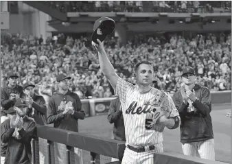  ?? BILL KOSTROUN/AP PHOTO ?? New York Mets third baseman David Wright (5) acknowledg­es the fans as he leaves the field after coming out of Saturday’s game against the Miami Marlins at New York during the fifth inning.