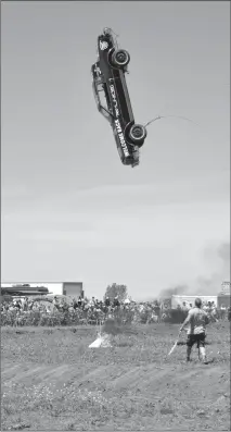  ?? Herald photo by J.W. Schnarr ?? The Coaldale Carnage Smash and Splash Demolition Derby and Mud Bog kicked off its eighth annual demolition derby and mud bog weekend on Saturday north of Coaldale by dropping a car from a crane. The event continues today.