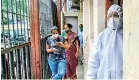  ??  ?? People who have recovered from the coronaviru­s wait to donate blood plasma at a screening at a school in Dharavi, in Mumbai. AFP