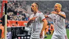  ??  ?? GETTY IMAGES Bayern Munich's Franck Ribery (L) celebrates scoring with his teammate Rafinha during the 3-1 victory over Bayer Leverkusen in Leverkusen’s Bayarena in western Germany on January 12, 2018.