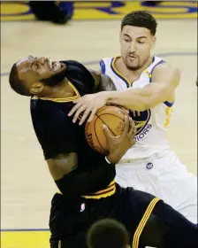  ?? ASSOCIATED PRESS ?? CLEVELAND CAVALIERS FORWARD LeBron James (left) is fouled by Golden State Warriors guard Klay Thompson during Sunday’s first half of Game 2 of basketball’s NBA Finals in Oakland, Calif.