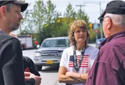  ?? JULIA O’MALLEY/FOR THE WASHINGTON POST ?? Sen. Lisa Murkowski, R-Alaska, talks with constituen­ts at a Fourth of July celebratio­n in Wrangell, Alaska. She garnered praise for her opposition to the Senate’s health care legislatio­n.