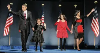  ?? Associated Press file photo ?? On Nov. 4, 2008, President-elect Barack Obama, wife Michelle and their daughters, Malia and Sasha, emerged as the nation’s next first family. Fifteen years later, this historic moment still resonates.