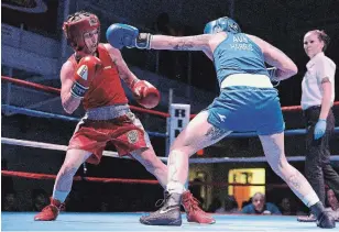  ?? IAN STEWART SPECIAL TO THE RECORD FILE PHOTO ?? Mandy Bujold, in red, battles Australian Kristy Harris in Kitchener in 2019.