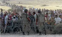  ?? PHOTO: REUTERS ?? Turkish soldiers have killed Syrian refugees trying to cross the more heavily fortified border, a rights group says.