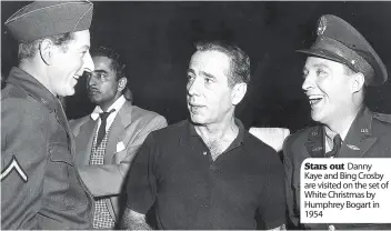  ??  ?? Stars out Danny Kaye and Bing Crosby are visited on the set of White Christmas by Humphrey Bogart in 1954