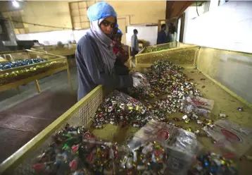  ?? — AFP photo ?? An employee works at the factory of food items and beverages owned by Sudanese businessma­n Samir Gasim, in the capital Khartoum. Many expected Sudan’s crisis-hit economy to recover after the US dropped a tranche of decades-old sanctions on October 12 last year. But businessme­n say Washington’s decision to keep Khartoum on its list of “state sponsors of terrorism” has doused those hopes.