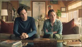  ?? AP ?? Penn Badgley, left, and Victoria Pedretti in a scene from “You,” a series that became a worldwide hit for Netflix after a low-key U.S. start on Lifetime.