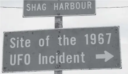  ?? Vernon Oickle ?? These road signs near Barrington Passage will lead you to the site of the Shag Harbour event that happened on the night of October 4, 1967, which has become the most documented UFO incident in Canadian history.