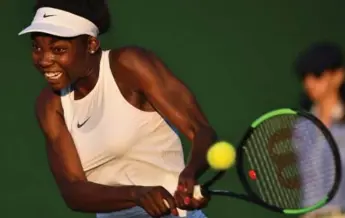  ?? GLYN KIRK/AFP/GETTY IMAGES FILE PHOTO ?? Françoise Abanda returns against Latvia’s Jelena Ostapenko during their singles second round at Wimbledon.