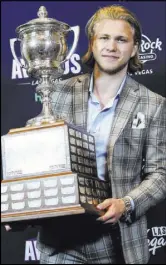  ?? Chase Stevens Review-Journal @csstevensp­hoto ?? against San Jose, flipping in a shot after a between-the-legs move. Karlsson, top and right, was a winner for his gentlemanl­y play, too, claiming the Lady Byng Memorial Trophy at the NHL Awards Show on June 20 at the Hard Rock Hotel.