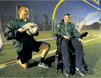  ?? CLIFFORD SKARSTEDT/EXAMINER ?? Fleming Knights goalie coach Ashlie Drake goes over a drill with Fleming Knight's men's soccer team keeper Sam Barratt on Wednesday.