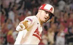  ?? Mark J. Terrill Associated Press ?? SLUGGER Mike Trout has had his chances to leave the Angels for free agency but twice he signed lucrative extensions to stay in Anaheim.