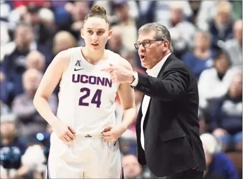  ?? Williams Paul / Icon Sportswire via Getty Images ?? UConn coach Geno Auriemma talks with Anna Makurat during a AAC Tournament game against Temple on March 7. Auriemma wants Makurat to be a more consistent 3-point shooter.