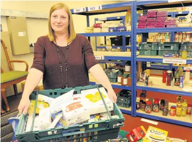  ??  ?? Running on empty Karen Dornan at East Kilbride Community Food Bank