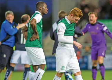  ??  ?? A living nightmare: Hibs players trudge off the pitch dejected after their play-off loss to Falkirk