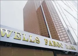  ?? Richard Vogel
Associated Press ?? WELLS FARGO’S latest acquisitio­n, which is expected to close early next year and add about 3,000 employees, will boost the company’s assets to $1.76 trillion.