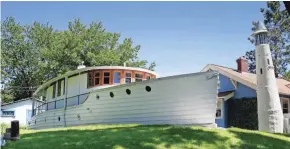  ?? MILWAUKEE JOURNAL SENTINEL RICK WOOD / ?? The Edmund B. Gustdorf Milwaukee Boathouse & Lighthouse dates back to 1925. The two-bedroom home sleeps six guests for around $175 a night.