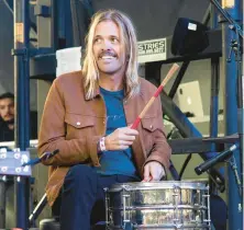  ?? AMY HARRIS/INVISION 2018 ?? Foo Fighters will honor late drummer Taylor Hawkins, above, with two tribute concerts.