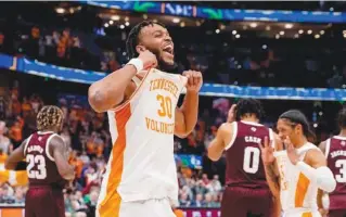  ?? TENNESSEE ATHLETICS PHOTO BY ANDREW FERGUSON ?? Tennessee guard Josiah-Jordan James celebrates after a 65-50 win over Texas A&M last March in Tampa that clinched the first Southeaste­rn Conference tournament title for the Volunteers since 1979.