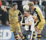  ??  ?? Sheffield Wednesday duo Liam Palmer and Tom Lees attempt to stop Bolton’s Aaron Wilbraham.