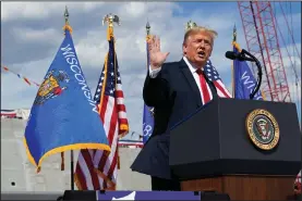  ?? (AP/Evan Vucci) ?? President Donald Trump promotes a contract Thursday that the Fincantier­i Marinette Marine shipyard in Marinette, Wis., won to build up to 10 Navy frigates.