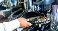  ?? — Photo by Neeraj Murali ?? A worker prepares some Arabica coffee at the Karam Coffee factory in Al Quoz, Dubai.