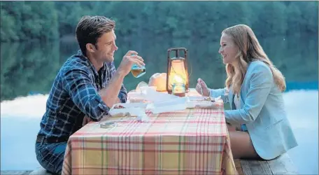  ?? Michael Tackett
20th Century Fox ?? LUKE
(Scott Eastwood, abs not in sight) and Sophia (Britt Robertson) share a special moment in the romantic film “The Longest Ride.”