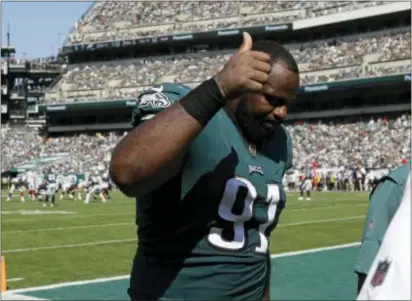  ?? MICHAEL PEREZ — THE ASSOCIATED PRESS ?? The Eagles’ Fletcher Cox was feeling all thumbs-up like while walking off the Lincoln Financial Field turf last Sunday after a last-second win over the Giants. Cox will not be walking onto the surface of a southern California soccer field this weekend...