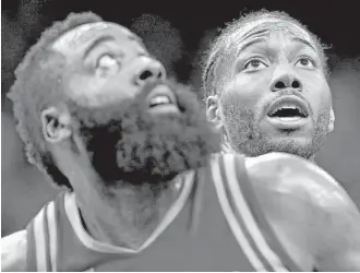  ?? Edward A. Ornelas / San Antonio Express-News ?? The Rockets’ James Harden, left, and the Spurs’ Kawhi Leonard struggle for position during a game March 6 in San Antonio. Each is a candidate for regular-season MVP honors.