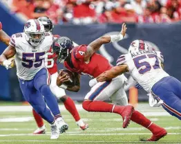  ?? Michael Ciaglo / Staff photograph­er ?? Texans quarterbac­k Deshaun Watson (4) is sacked by Bills linebacker Lorenzo Alexander (57) in the fourth quarter. Watson was sacked seven times Sunday.