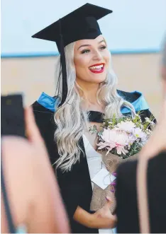  ??  ?? EXCITED: Halee Vanderstee­n at yesterday’s JCU graduation at the Cairns Convention Centre.