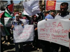  ?? AFP ?? In the West Bank city of Ramallah, Palestinia­n demonstrat­ors made their disapprova­l of the US delegation clear