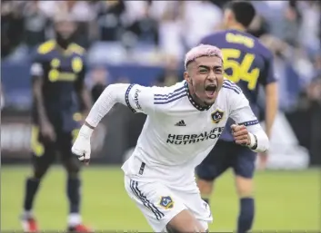  ?? ?? LA Galaxy defender Julian Araujo reacts after scoring a goal against Nashville SC during the second half of an MLS playoff soccer match, in Carson, Calif., in 2022.