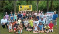  ??  ?? Archery was the main course this summer at the Chester County Conservati­on Camp held at Paradise Farms in Downingtow­n where these youngsters and instructor­s enjoyed bow bending activities courtesy of Backyard Bucks.