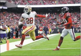  ?? ERIC CHRISTIAN SMITH — ASSOCIATED PRESS ?? The 49ers’ Carlos Hyde gets around the Texans’ Andre Hal for a touchdown.