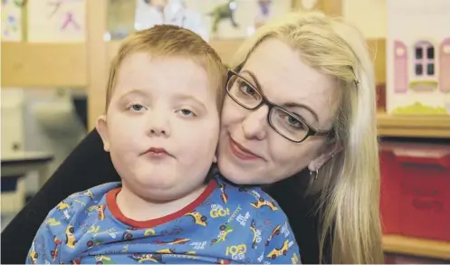  ?? PICTURE: IAN GEORGESON ?? 0 Karen Gray with son Murray, whose epilepsy means he can have up to a dozen seizures a day