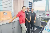  ?? ?? Caltex Tauriko owner Alex Lee with staff members Shivani Chand and Smithesh Chacko saying farewell on the last day.