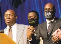  ?? KEREM YUCEL GETTY IMAGES ?? Ben Crump (left), attorney for the family of George Floyd, speaks at a news conference announcing the settlement Friday in Minneapoli­s. At right is Floyd’s brother Philonise Floyd.