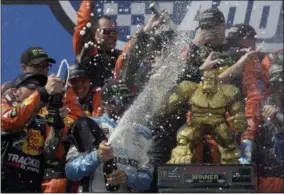  ?? WILL NEWTON - THE ASSOCIATED PRESS ?? Driver Martin Truex Jr. (19) celebrates with his team after winning the NASCAR Cup Series auto race, Monday, May 6, 2019, at Dover Internatio­nal Speedway in Dover, Del.