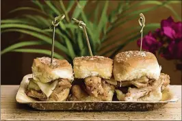  ?? CONTRIBUTE­D BY SUNFEST PHOTOS ?? The hand-pulled Hawaiian Chicken Sliders ($13) meld flavors of soy sauce, pineapple, brown sugar and Asian spices into a marinade for the slowly braised chicken.